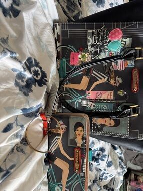 Nicole Lee Black Tote and Printed Wristlet with Teal, Pink & Red Accents